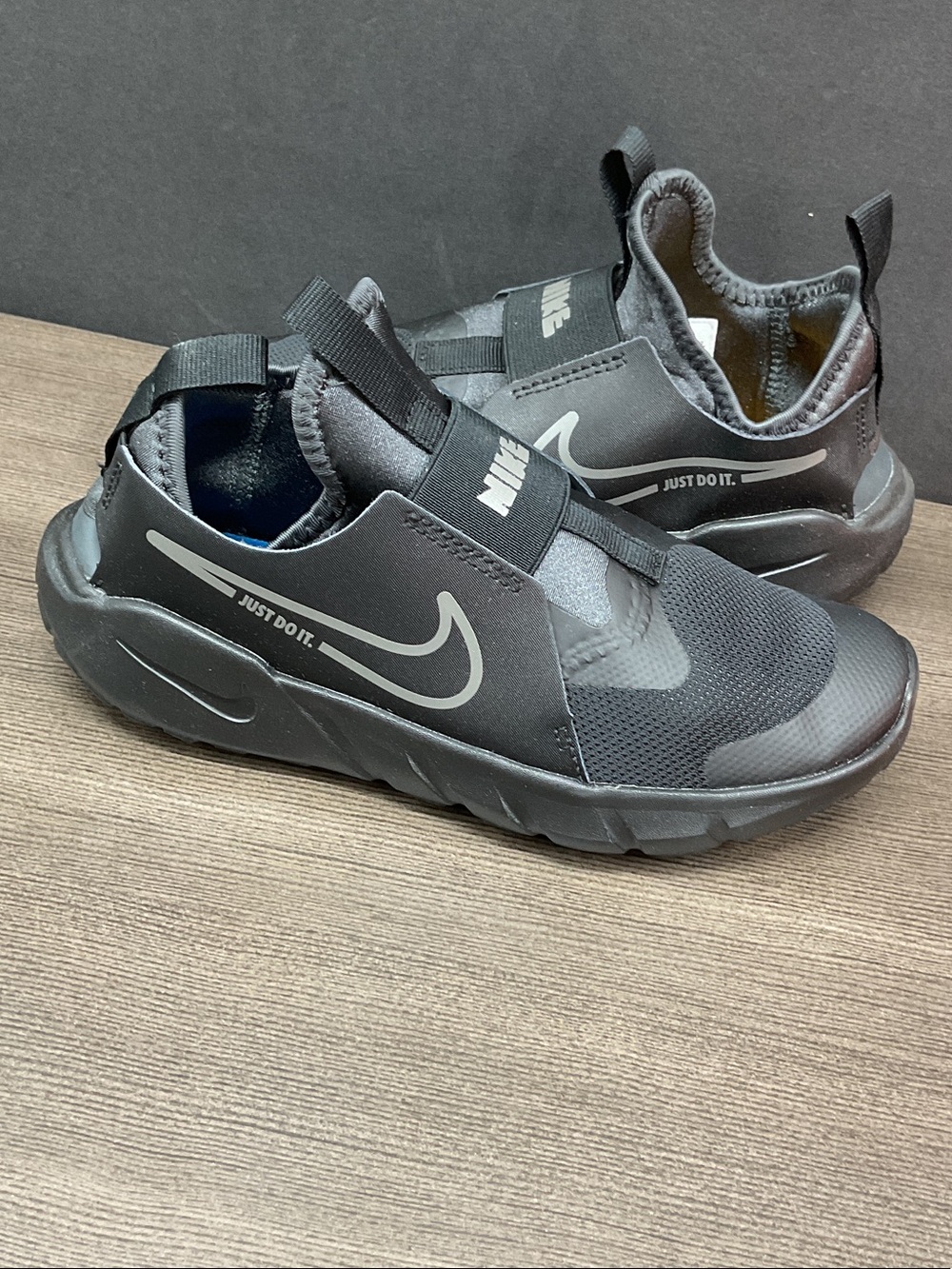 Nike Kids Black Slip-On Athletic Sneakers with Reflective Swoosh